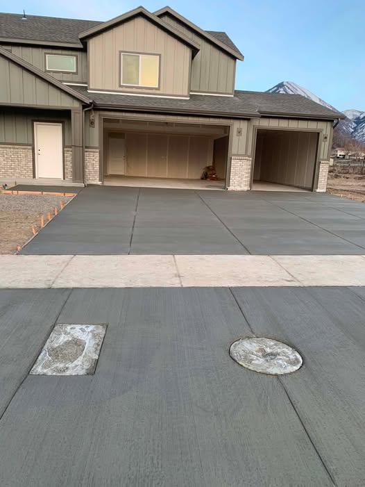 Concrete driveway approach with Utah mountains behind