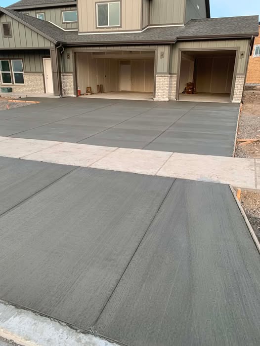 Wide residential concrete driveway with joint layout